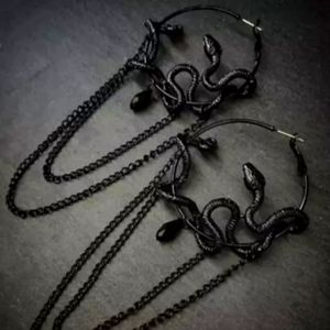 Solid black metal serpent earrings